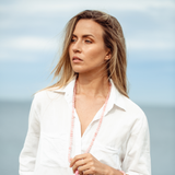 Woman outside looking into the distance wearing Ambarya Unconditional Love - Rose Quartz Mala Bead Necklace wearing