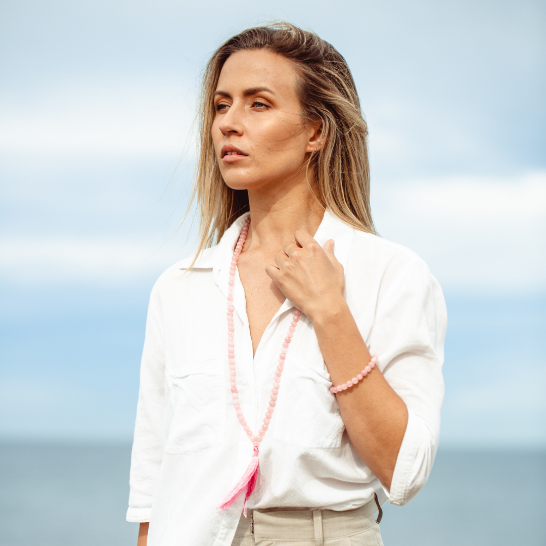 Woman wearing Rose Quartz crystal Mala Bead Set