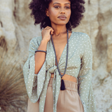 Woman standing outside wearing Ambarya Strength - Hematite Mala Bead Set