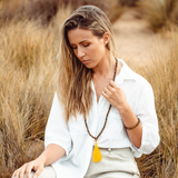 Woman wearing Tiger’s Eye crystal Mala Bead Set