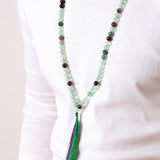 Close up of man wearing Ambarya Clarity - Rainbow Fluorite crystal Mala Bead Necklace