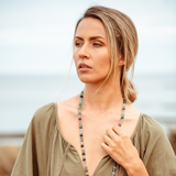 Woman wearing Woman wearing Rainbow Fluorite crystal Mala Bead necklace