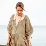 Woman looking down wearing Clarity - Rainbow Fluorite Mala Bead Necklace