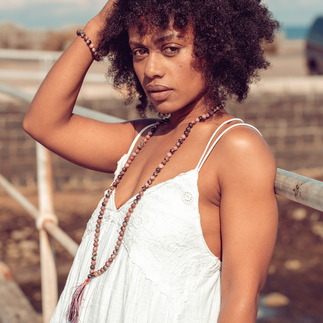 Close up of woman wearing Ambarya Emotional Balance - Rhondonite Mala Bead Set