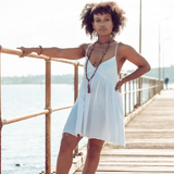 Woman standing looking at the camera wearing Ambarya Emotional Balance - Rhondonite Mala Bead Set