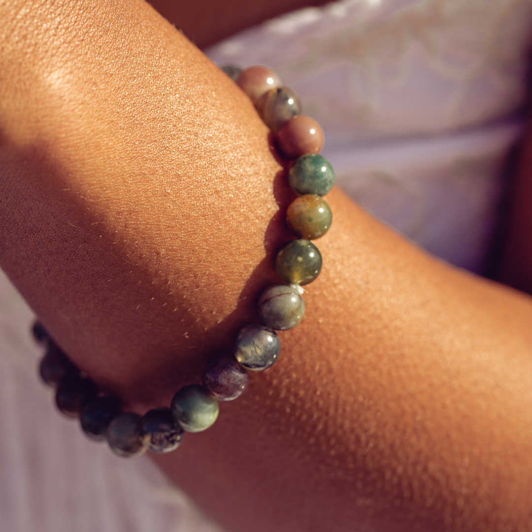 Close up of woman's wrist wearing Ambarya Good health - Bloodstone Mala Bead Bracelet