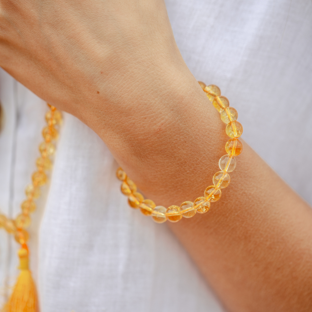 Close up of Citrine crystal Mala Bead bracelet