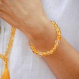 Close up of Citrine crystal Mala Bead bracelet