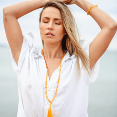 Woman wearing Citrine crystal Mala Bead Set