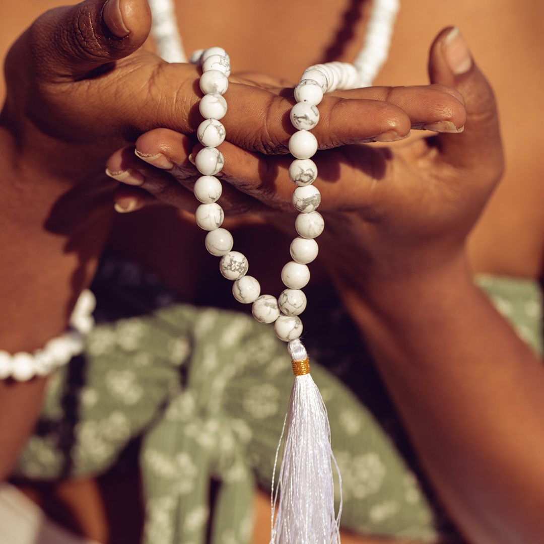Close up of woman holding Ambarya Patience - Howlite Mala Bead Necklace