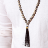 Close up of Man wearing Ambarya Playfulness - Dalmatian Stone Mala Bead Necklace