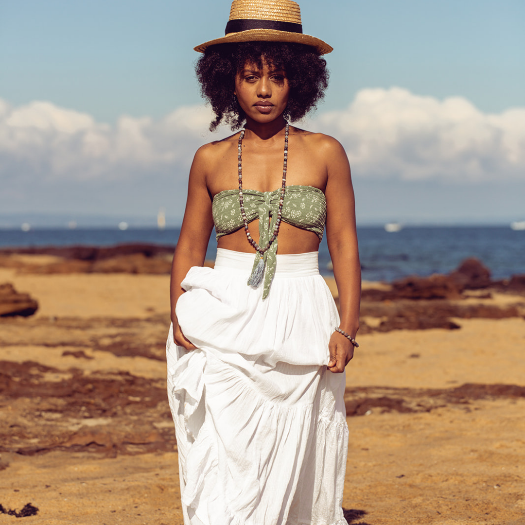 Woman walking towards the camera she is wearing Ambarya Acceptance - Botswana Agate Mala Bead Set