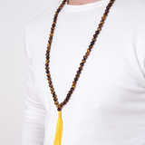 Close up of man wearing Ambarya Courage - Tiger’s Eye crystal Mala Bead Necklace