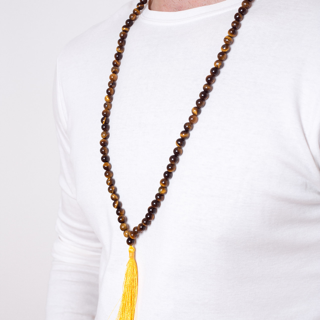 Close up of man wearing Ambarya Courage - Tiger’s Eye crystal Mala Bead Necklace